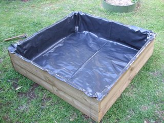 Bottom bed lined with builders plastic